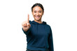 © luismolinero - Young Uruguayan woman over isolated chroma key background showing and lifting a finger