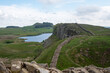 A section of Hadrian's Wall at Roman military base Milecastle 39, against the backdrop of Whin Sill and Crag Lough. Northumberland National Park, UK