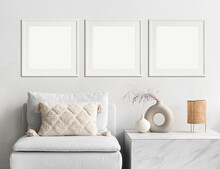 Blank Picture Frame Mockup On White Wall. Modern Living Room Design. View Of Modern Scandinavian Style Interior With Sofa. Three Square Templates For Artwork, Painting, Photo Or Poster