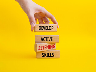 listening skills symbol. concept word develop active listening skills on wooden blocks. beautiful ye