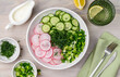 Summer vegetable  salad of radish and cucumber with dill and green onions. Healthy vegetarian salad. Top view