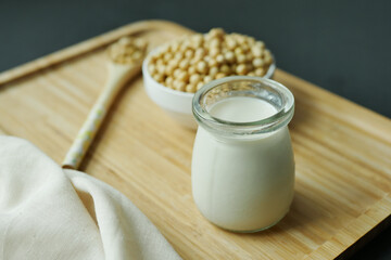 Poster -  soy milk pouring in a glass jar 