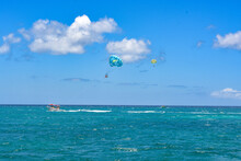 A Beautiful View On Parasailing Parachutes Over Turquoise Blue Caribbean Sea. Tropical Holiday Vibes. Space For Text. 