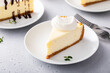 Slice of a traditional New York cheesecake with whipped cream