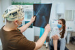 © maxbelchenko - Doctor examines x-ray of patient leg. Foot and sprain concept. Sport exercise injuries.