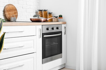 Sticker - Modern electric oven in interior of light kitchen