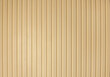 Ribbed wooden wall panels, background texture. Modern wall design with vertical wooden slats.