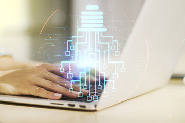 Poster - Creative light bulb with chip hologram and hands typing on computer keyboard on background, artificial Intelligence and neural networks concept. Multiexposure