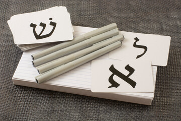 Tools for learning biblical Hebrew of index cards for vocabulary, calligraphy pens and alphabet flash cards