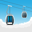 ski cabin lift for mountain skiers and snowboarders moves in the air on a cableway