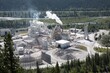 © Cavan Images - Aerial view of cement plant in mountains