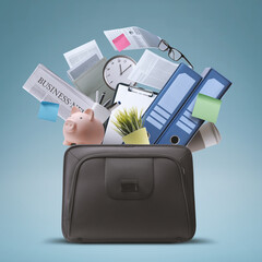 Wall Mural - Briefcase full of office supplies