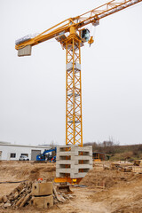 one construction crane stands on a building site