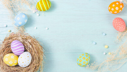 Wall Mural - Happy easter Day. Easter eggs on wooden background. Greetings and presents for Easter Day celebrate time. Flat lay ,top view, copy space.