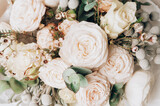 Fototapeta Kwiaty - Flower design and floristry. Beautiful delicate flowers bouquet background made with ranunculus, peony rose, brunia, rose and eucalyptus.