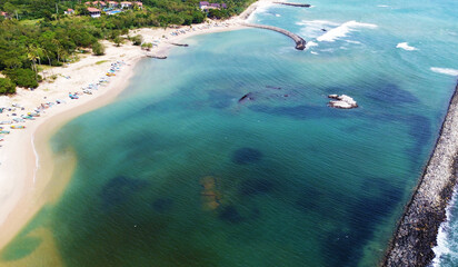 Wall Mural - Aerial view of the tropical ocean landscape with a beach. Beautiful southern sea wallpaper for tourism and advertising. Asian landscape, drone photo