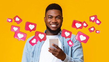 Poster - Glad black adult man with beard has romantic chat with hearts on smartphone enjoys message, social networks
