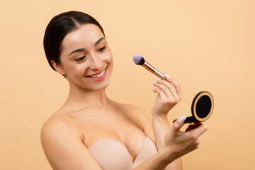 Wall Mural - Beauty Routine. Happy Indian Woman Holding Compact Powder And Makeup Brush