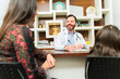 © AntonioDiaz - Happy pediatrician doctor taking with a family
