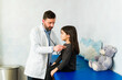 © AntonioDiaz - Doctor using a stethoscope during a medical check-up of a child