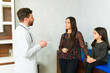 © AntonioDiaz - Worried mother talking with the doctor about her sick daughter