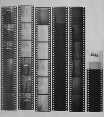 Wall Mural - long blank 35mm black and white film strips printed on white copy paper with empty frames.