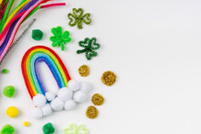Rainbow And Clover Made Of Beads And Pipe Cleaners With Different Multi-colored  Materials For DIY Art Activity For Kids. Cute Children's Crafts Of St Patrick's Day. Creativity And Hobby.