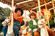 © Valerii Apetroaiei - Kids having fun on a carnival Carousel
