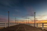 Fototapeta  - Wschód słońca widziany z molo nad Zatoką
