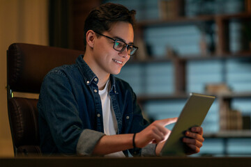 Aufkleber - Smiling young man holding using digital tablet pc at office
