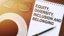 Equity, Diversity, Inclusion, Belonging. Text On Notebook With Coffee And Eyeglasses. Business, Signs.