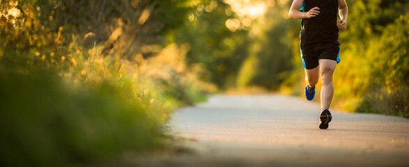 Shot of a young male athlete training. Getting his daily dose of mileage, to stay fit and lean.