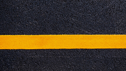 Yellow line on new asphalt detail, Street with yellow line texture