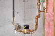 Home's main water line, meter, shutoff valves and copper grounding wire with clamp