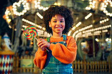 Kids Having Fun On A Carnival Carousel