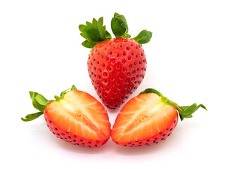 Wall Mural - A whole strawberry and a strawberry cut in half on a white background isolated. Appetizing strawberries