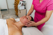 © DusanJelicic - Cosmetologist giving a relaxing massage on client's face in spa salon before a face mask