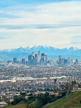View At Downtown Los Angeles With The Snowcapped San Gabriel Mountains In The Background. 