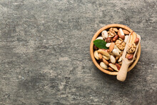Mixed Nuts In Bowl. Mix Of Various Nuts On Colored Background. Pistachios, Cashews, Walnuts, Hazelnuts, Peanuts And Brazil Nuts