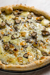 Wall Mural - pizza with cheese and truffle on white marble table vertical macro close up