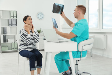 Sticker - Doctor with neck MRI images consulting patient in clinic