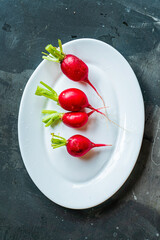 Sticker - organic radishes on the white plate