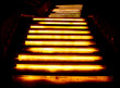 Steps on the stairs at night in the illumination of lanterns.