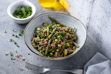 Canvas Print - Green beans with minced meat in bowl