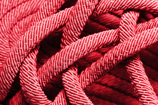 Rope pattern. Sailor texture. Flip Flops made with rope. Sailors clothing background. Red color twisted string.