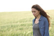 © Antonioguillem - Sad woman in a wheat field