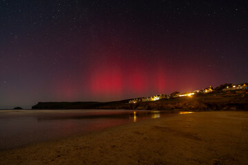 Wall Mural - aurora borealis over polzeath beach on cornwalls north coast 26/02/23