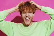 © Drobot Dean - White young redhead man touching his head and screaming at camera