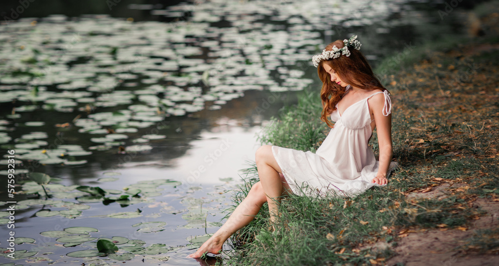 Beautiful red haired girl in white vintage dress and wreath of flowers ...