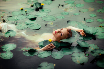 Wall Mural - Beautiful red haired girl in white dress posing in river with water lilies. Fairytale story about  ophelia .Warm art work.